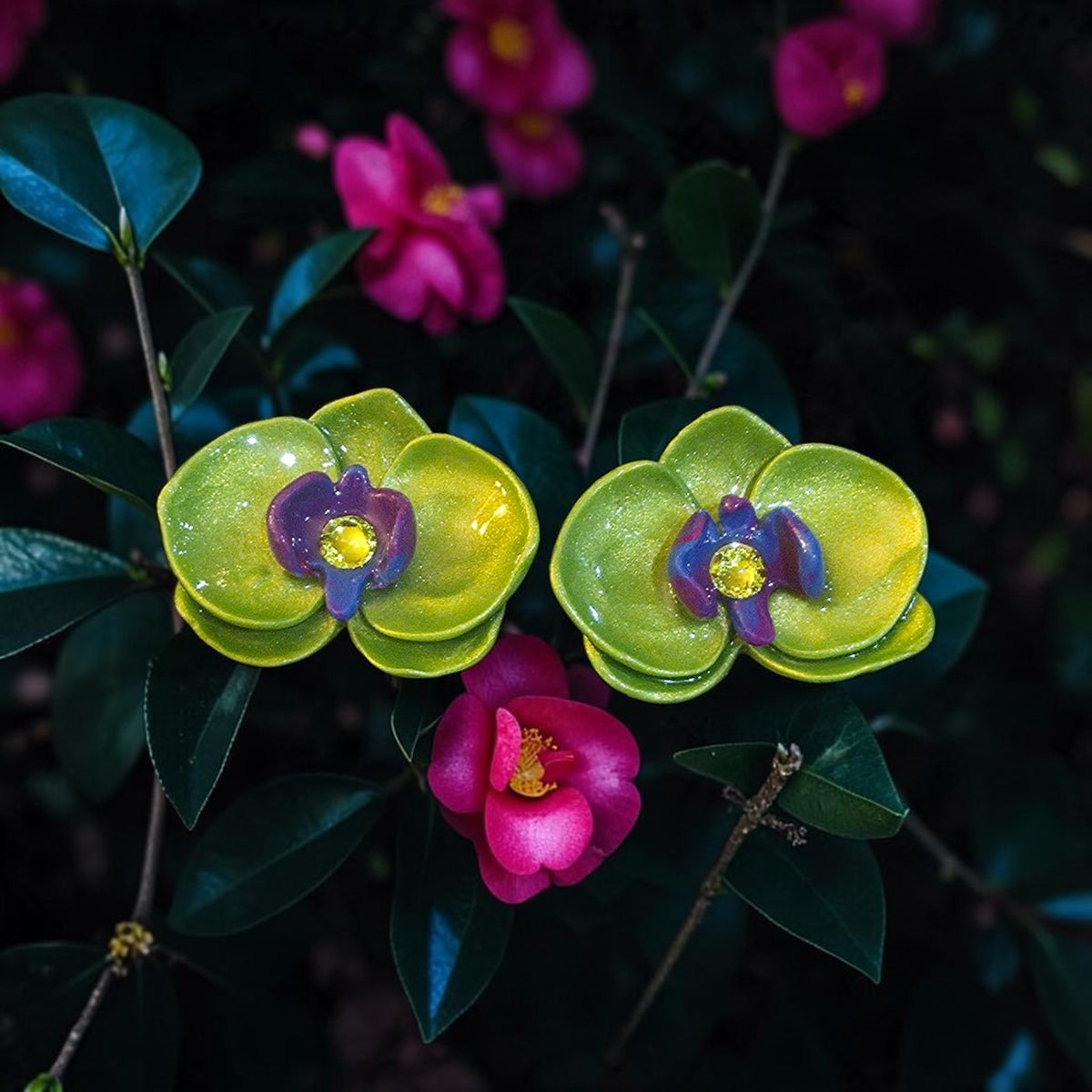Lime green orchid-inspired polymer clay stud earrings with purple centers and a glossy resin finish